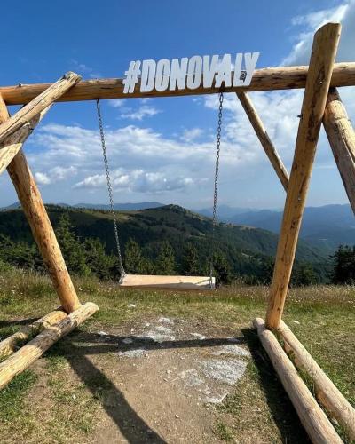 a wooden gate with a sign that says doomsday at APARTMÁN MEZONET DONOVALY Plesnivec in Donovaly