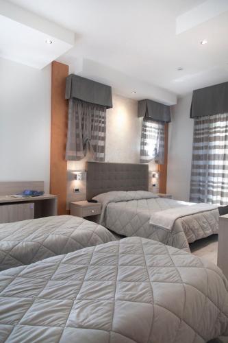 Cama o camas de una habitación en Hotel Gabbiano