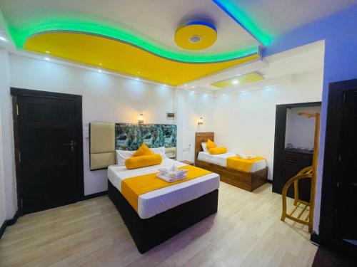 Postel nebo postele na pokoji v ubytování Wilroma Hotel&Resort