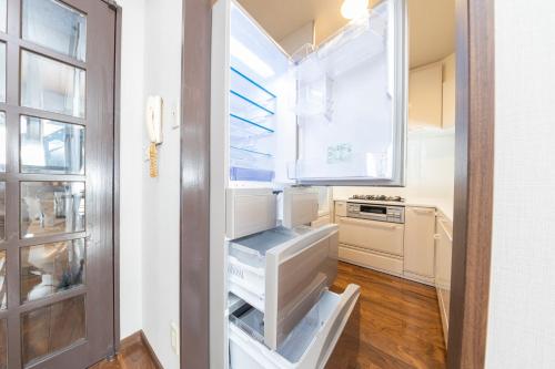 Kuchyň nebo kuchyňský kout v ubytování UNITEDCUBE STAY TOKYO Private urban vacation home