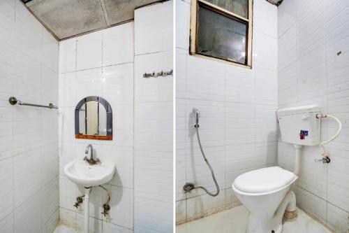 a bathroom with a toilet and a sink at HOTEL MANGALAM LUXUARY INN Near Railway station - A LUXUARY HOTEL in Lucknow