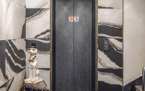 a room with a snowman standing next to a chair at THE OCEAN Pension in Sokcho