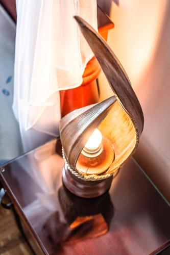 a lamp sitting on a table on a table at Villa Roses Apartments & Wellness in Ičići