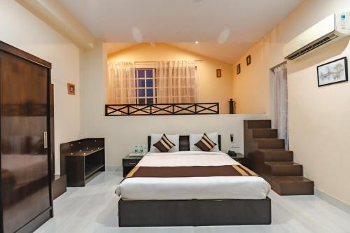 Postel nebo postele na pokoji v ubytování Boutique Villa by Hotel Saffron Leaf