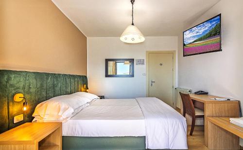 A bed or beds in a room at Hotel Virginia