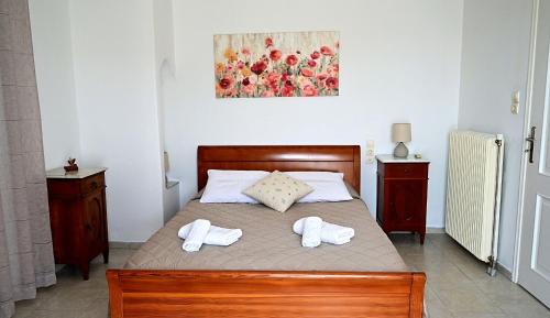 Ένα ή περισσότερα κρεβάτια σε δωμάτιο στο Villa Vigles