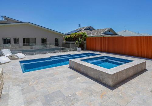 a swimming pool in the backyard of a house at The Great Escape at Shell Cove in Dunmore