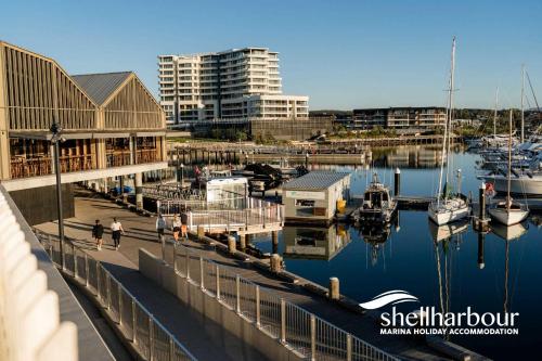 a marina with buildings and boats in the water at The Great Escape at Shell Cove in Dunmore