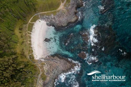 an aerial view of the ocean and a beach at The Great Escape at Shell Cove in Dunmore