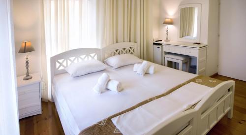 Postel nebo postele na pokoji v ubytování Ontas Traditional Hotel