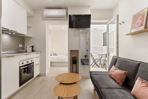 a living room with a couch and a table at Cala Arena-few steps from the beach in La Cala de Mijas