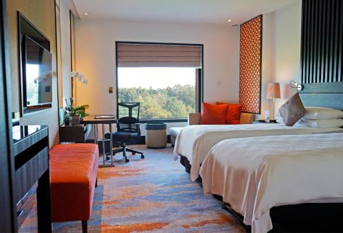 Postel nebo postele na pokoji v ubytování Sama Sama Hotel KLIA