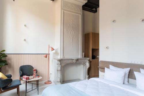 Postel nebo postele na pokoji v ubytování Anne&Max Boutique Hotel