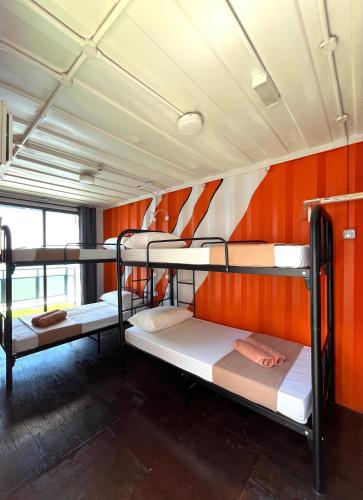 a group of bunk beds in a room at Perhentian Nemo Chalet in Perhentian Island
