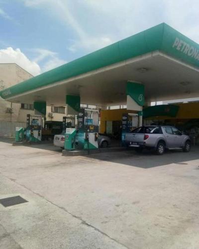 a car parked in front of a gas station at Casa Hotel near KLIA 1 in Sepang