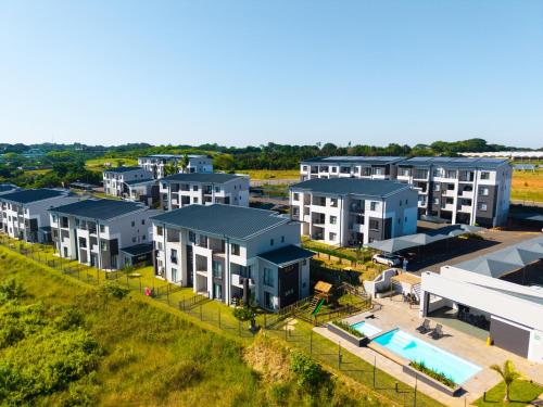 an aerial view of an apartment complex with a pool at Bliss Ballito by First Private Stays in Ballito