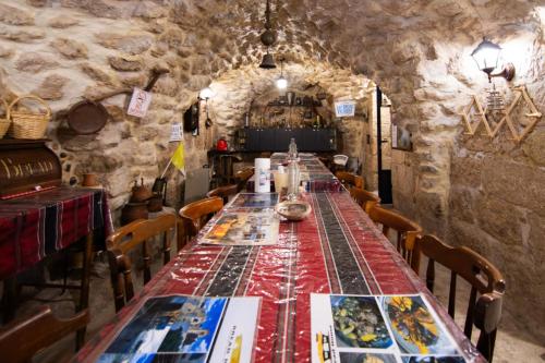 a long dining room with a long table and chairs at BREAD HOUSE in Bethlehem