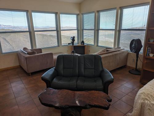 a living room with a couch and a chair at Unique Mountain Gem-Sauna Hot Tub Scenic View in Julian
