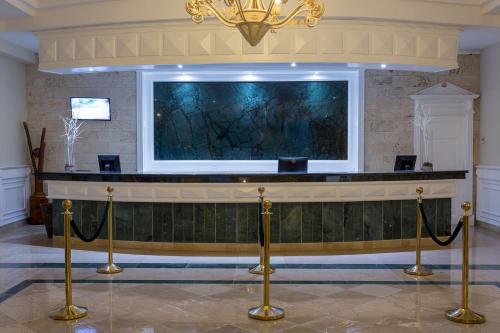 a bar in a lobby with a large screen at Eurostars Grand Cayacoa in Santa Bárbara de Samaná