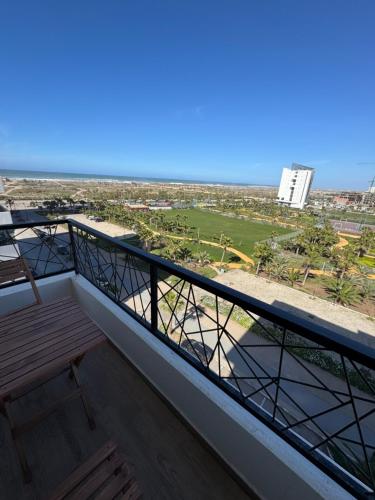 a balcony with a view of the beach at Évasion zen près de Casablanca - Vue imprenable sur le parc et la plage de l'Éco City Zenata in Aïn Harrouda