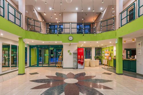 a lobby of a building with a red vending machine at Geovita Lądek Zdrój in Lądek-Zdrój