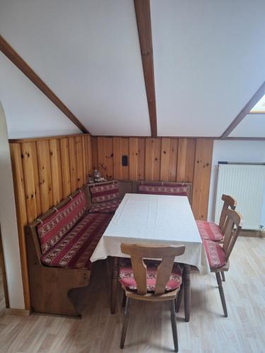 a dining room with a table and chairs at Ferienwohnung Franz Jägershof 27 in Neukirchen beim Heiligen Blut