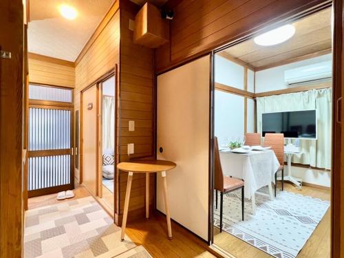 a small room with a table and a dining room at Direct to Akihabara Shinjuku Max 6 people in Tokyo