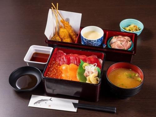 three trays of food sitting on a wooden table at Hakone Kowakien Miyamafurin in Hakone