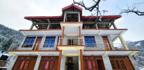 a man standing in front of a building at The RAHIL's Kalga in Kalgha