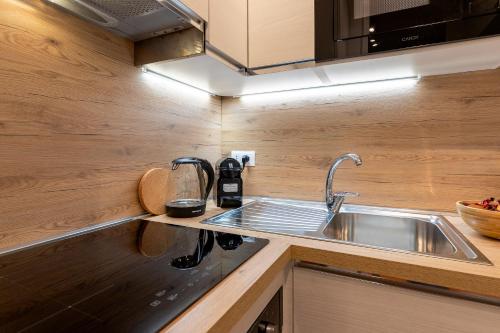 a kitchen with a sink and a counter top at Casa Marina in Pesaro