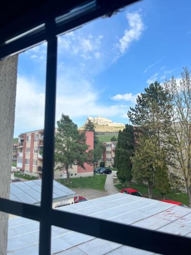 a view of a mountain from a window at Penzión u Kastelána in Spišské Podhradie