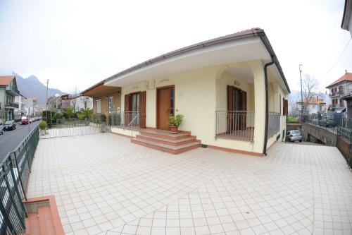 a house with a large patio in front of it at Da zio Antonio Rooms in Agerola