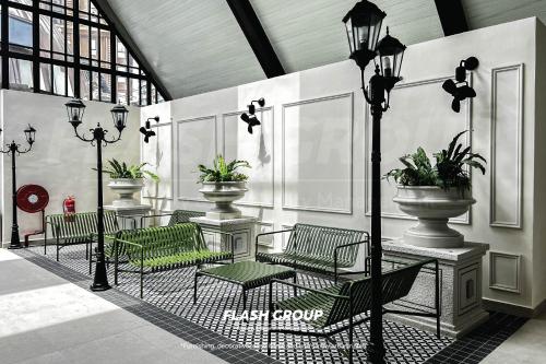 a group of chairs and lights in a building at Paxtonz Premium Suites Petaling Jaya in Petaling Jaya