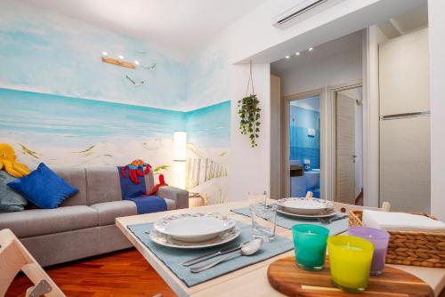 a living room with a couch and a table at Casa Marina in Pesaro