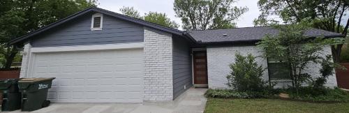 a house with a garage with at Breathe Easy Here in Buda 3bd 2ba Home in Buda