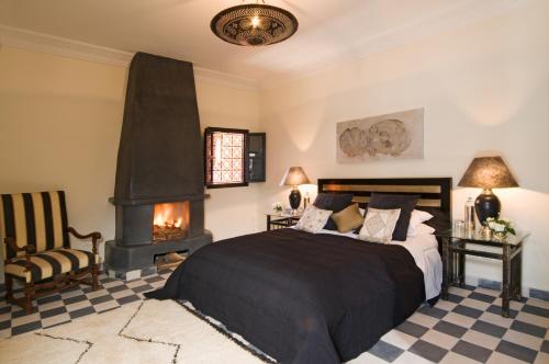 Llit o llits en una habitació de Riad Elizabeth