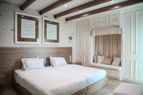 Ένα ή περισσότερα κρεβάτια σε δωμάτιο στο Limani Luxury Apartments Beachfront