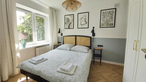 En eller flere senge i et værelse på Olive Garden City Center