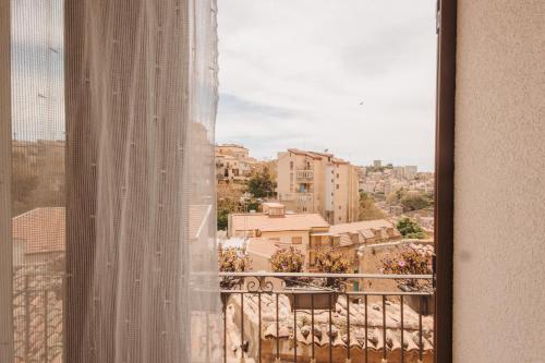 a view from a window of a city at La Casa Di Pinocchio in Enna