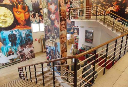 a staircase in a room with a bunch of posters at City Garden Loft in Pescara