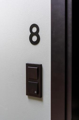 a wall with a number eight on it at Core - Corporate Studios by Weeklyflex in Strassen