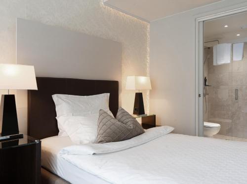 Postel nebo postele na pokoji v ubytování Elite Eden Park Hotel