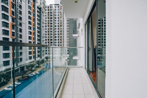 a balcony in a building with views of buildings at K AVENUE TOWER B by The Pillow House, 5 Minutes to KKIA Airport in Penampang