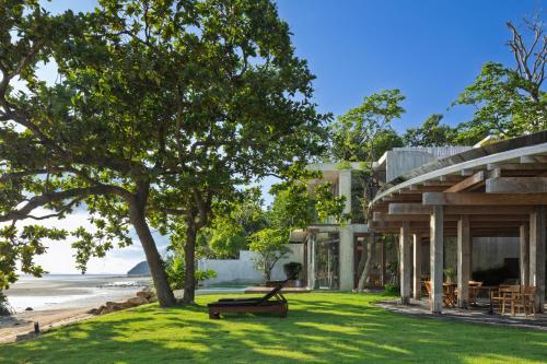 a house with a view of the beach at Vows Villa Beachfront in Ban Bang Po