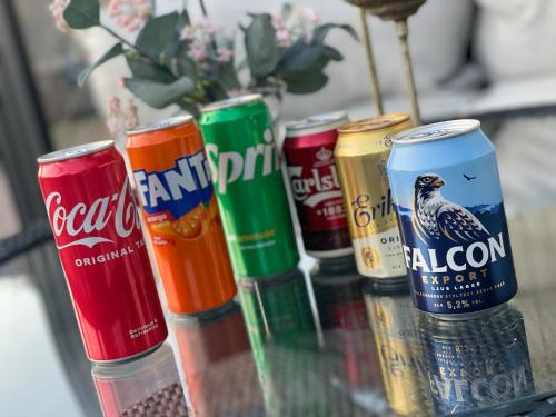 a group of soda cans sitting on a table at Cozy and pet friendly guest house in Öjersjö