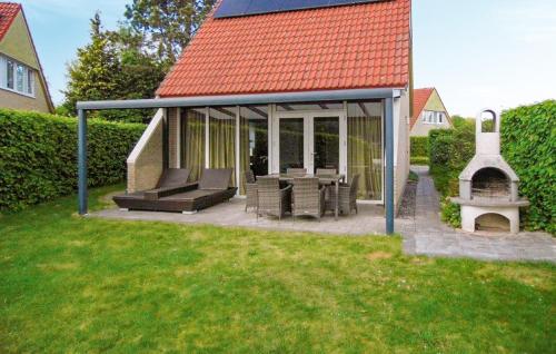 a screened in porch of a house with a grill at 3 Bedroom Nice Home In Vlagtwedde in Vlagtwedde