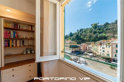 a window with a view of a city at Vela by PortofinoVip in Portofino