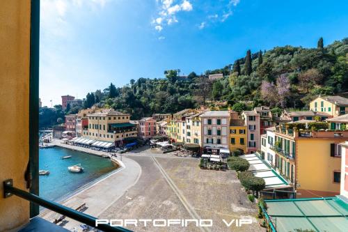a view of a town with a river and buildings at Vela by PortofinoVip in Portofino