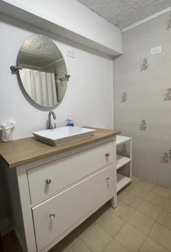 a bathroom with a sink and a mirror at Montecielo-Mountain View Escape 20 minutes to Airport in Canovanas