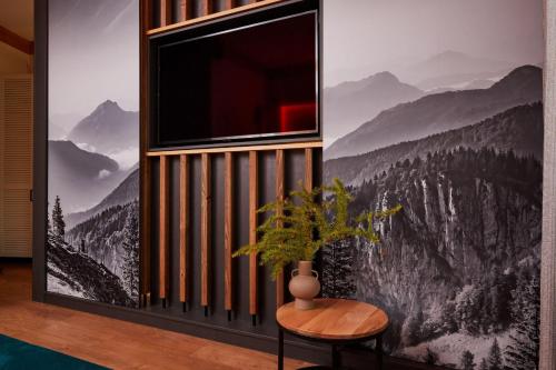 a room with a window with a view of mountains at Best Western Plus Hotel Erb in Parsdorf